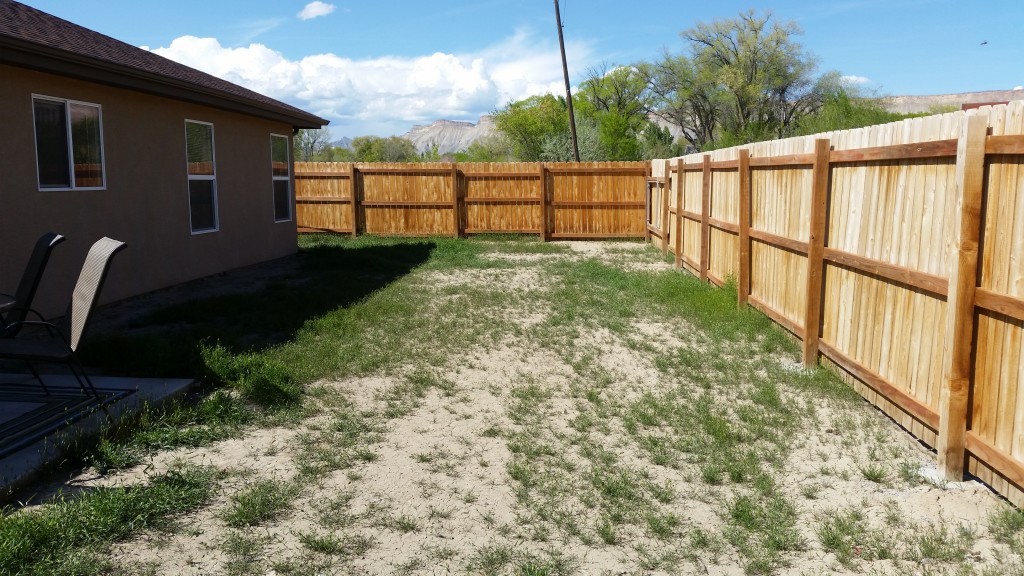 Blank slate in the back yard. Client wants raised beds along fence, firepit, pondless waterfall and extended patio.